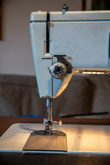 Sewing machine arm and needle from the front 
