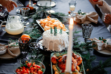 Christmas white cake on a table with pine branches