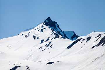 Fototapeta na wymiar Der Tappenkarsee mit Schnee in Kleinarl Wagrain