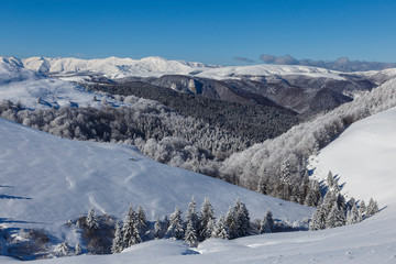 Winter panorama of mountains on a sunny day. Carpathians.