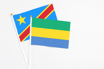 Gabon and Congo stick flags on white background. High quality fabric, miniature national flag....