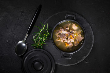 Chicken gizzards stewed with carrot in sauce.