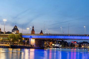 Szczecin City skyline reflected in the Odra River at dusk, Poland.