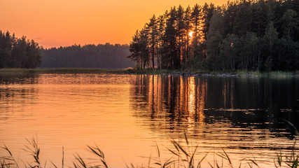 Sunset on lake in summer