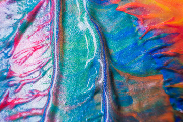 Macro photo. Paint of red, orange, green blue, pink shades close up. Abstract bright image of...