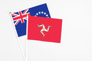 Isle Of Man and Cook Islands stick flags on white background. High quality fabric, miniature...