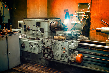 Obsolete metal lathe in an old machine shop