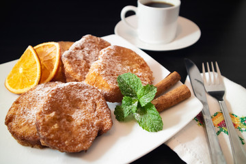 Spanish breakfast food Torrijas with coffee. Selective focus.
