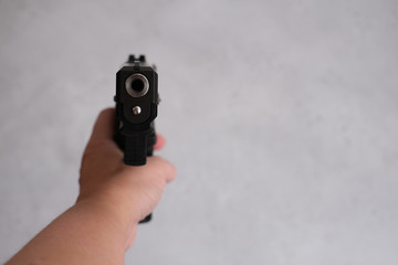 The young woman takes aim in his direction. weapons in the hands of, a crossbow, thought about...