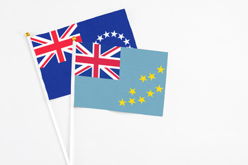 Tuvalu and Cook Islands stick flags on white background. High quality fabric, miniature national...