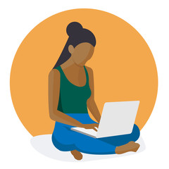 Mixed Race Woman working on laptop, Sitting Crosslegged on the floor