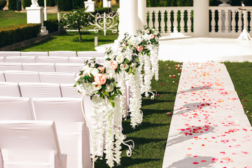 wedding ceremony white path and flower petals