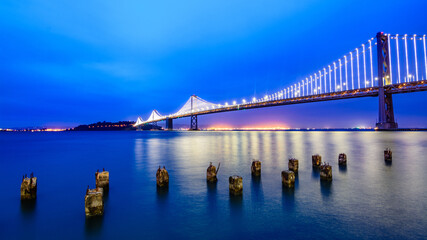 evening colours with many lights on the Bay Bridge in San Francisco