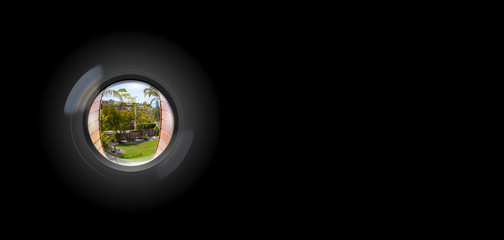 View through peephole in door looking out to entry - obrazy, fototapety, plakaty
