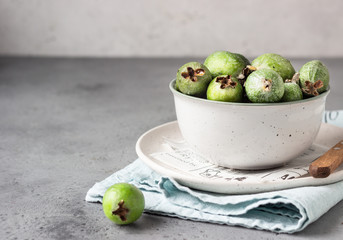 Green feijoa. Berries of the guava family. Tropical fruit. Healthy vegetarian food. Copy space.