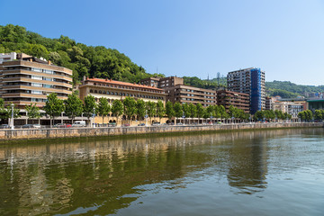 Fototapeta premium Bilbao, Spain. A scenic view of the Nervión river and waterfront