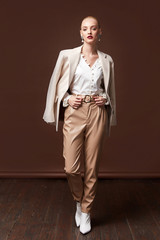 Sexy beautiful business woman lady boss CEO manager makeup long curly hair blond wear clothes...