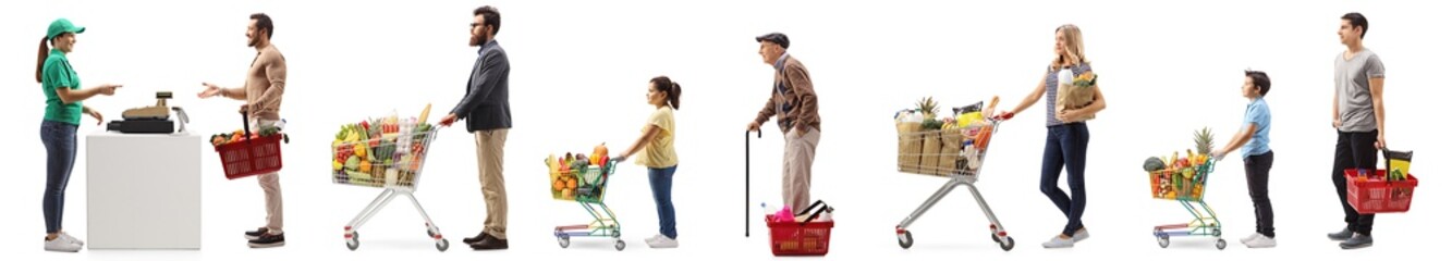 People with shopping carts and baskets waiting in line at the cash register