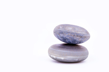 Pile of stones isolated on white background, Stones for massage and zen lifestyle. Mystic stones in balance.