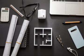 Construction concept. Residential building drawings and house model,