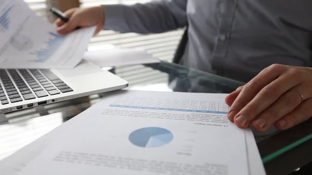 business man working on financial plan or strategy, asset management for investor, checking annual report
