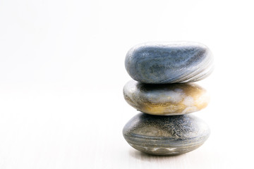 Pile of stones isolated on white background, Stones for massage and zen lifestyle. Mystic stones in balance.