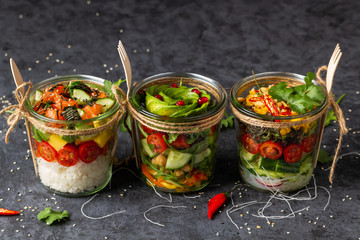 Poke salad with vegetables , salmon. avocado in a jar.Healthy food