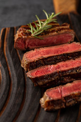 Medium Ribeye steak on the wooden cutting board