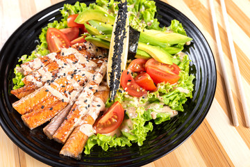 Salmon grilled salad, with herbs and lemon.