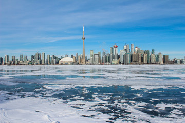 Toronto skyline with frozen lake, frozen lake and city, city skyline with frozen lake, frozen water, great lake frozen, beautiful sunny day with city buildings, sunny winter day, city skyline winter 