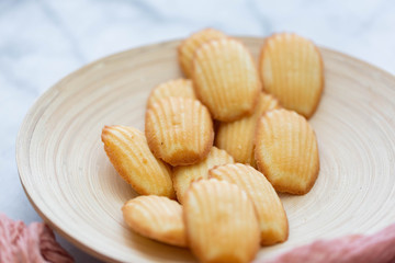 Plate of Madeleines on Marble Background