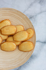 Plate of Madeleines on Marble Background
