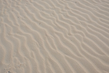 Fototapeta na wymiar Wellen im Sand