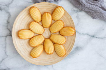 Plate of Madeleines on Marble Background