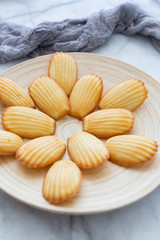 Plate of Madeleines on Marble Background