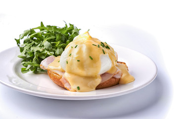 Egg benedict on the plate