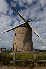 Fototapeta na wymiar the windmill at the top of the hill