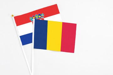 Chad and Croatia stick flags on white background. High quality fabric, miniature national flag. Peaceful global concept.White floor for copy space.