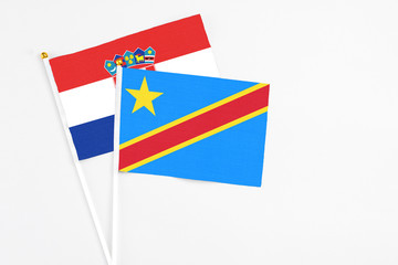 Congo and Croatia stick flags on white background. High quality fabric, miniature national flag. Peaceful global concept.White floor for copy space.
