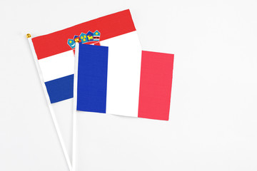 France and Croatia stick flags on white background. High quality fabric, miniature national flag. Peaceful global concept.White floor for copy space.