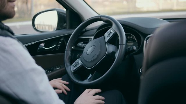 Steering wheel moving in a self-parking car.
