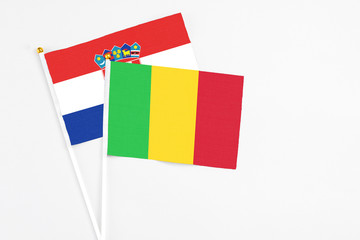 Mali and Croatia stick flags on white background. High quality fabric, miniature national flag. Peaceful global concept.White floor for copy space.