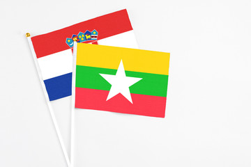 Myanmar and Croatia stick flags on white background. High quality fabric, miniature national flag. Peaceful global concept.White floor for copy space.