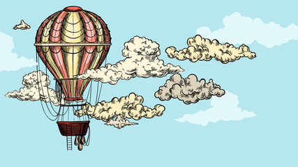 Vintage balloon in the sky between clouds