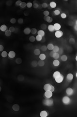 Black and white background of abstract bokeh lights
