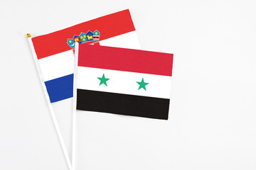 Syria and Croatia stick flags on white background. High quality fabric, miniature national flag. Peaceful global concept.White floor for copy space.