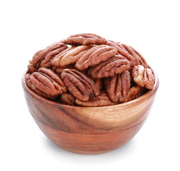 Bowl with tasty pecan nuts on white background