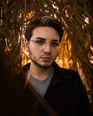 Beautiful gay male model at sunset in Kansas City Park