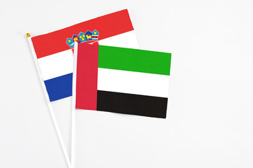 United Arab Emirates and Croatia stick flags on white background. High quality fabric, miniature national flag. Peaceful global concept.White floor for copy space.