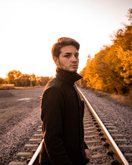 Beautiful gay male model at sunset in Kansas City Park